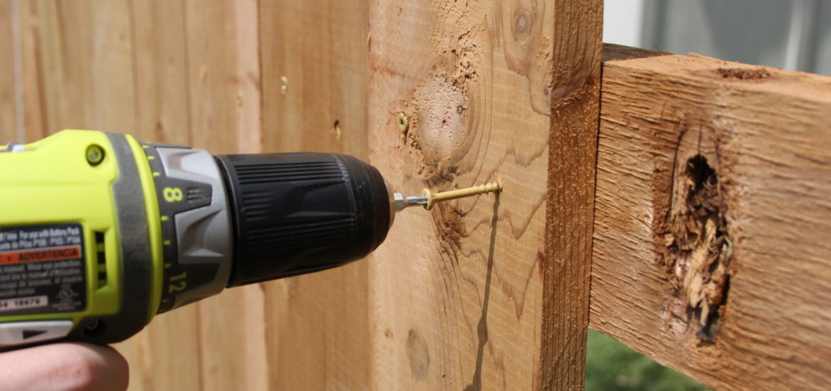 Close up of drill; building a fence